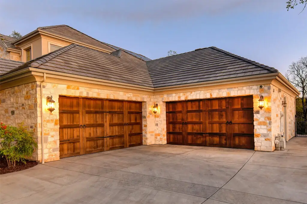 brown custom brown wood garage doors with black door handles